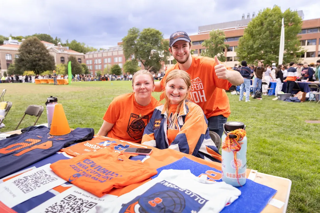 Students at a table at the involvement fair.